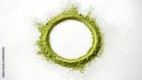 Top view of green matcha tea powder circle frame on white background with ingredient superfood culinary antioxidant background minimalist nutrition