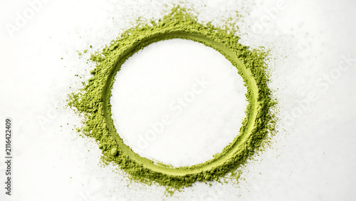 Green matcha tea powder arranged in a perfect circle frame on white background with beverage ingredient japanese caffeine superfood culinary antioxidant preparation decoration