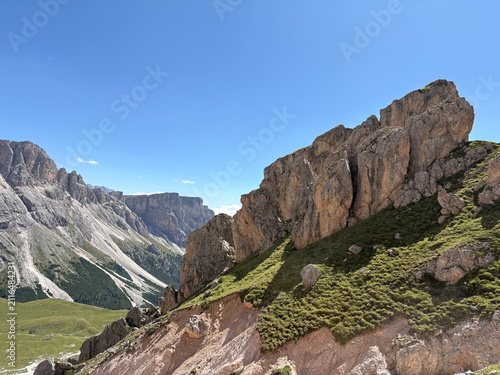 scenic view of the wonderful Dolomite peaks in summer between rocks and valleys