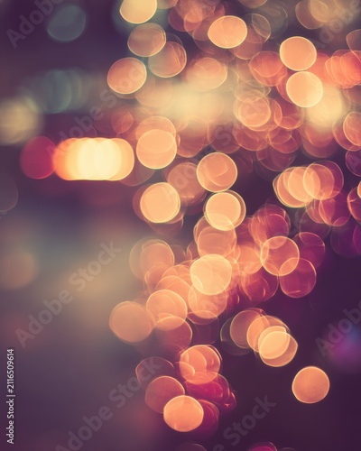 Abstract bokeh lights background with warm tones and blurred effect creating a festive and magical atmosphere for holiday season