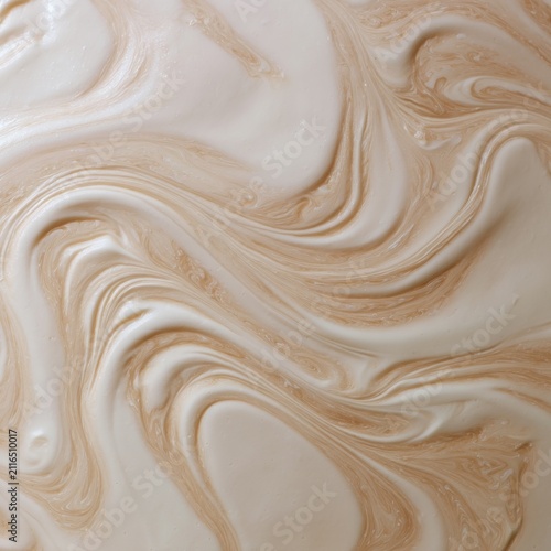 Swirling Creamy Texture Abstract Background Close Up Top Down View Showing Beige and White Colors with Fluid Motion