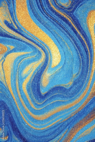 Abstract Blue and Gold Glitter Swirls in Fluid Art Style Close Up Shot for Background Texture Design