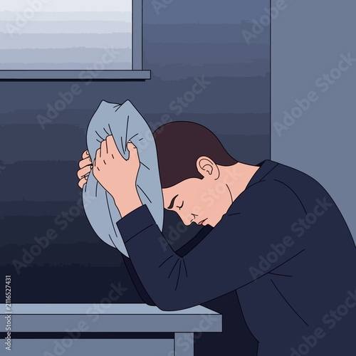 Depressed Man Hiding Face In Pillow Overwhelmed By Sadness And Solitude