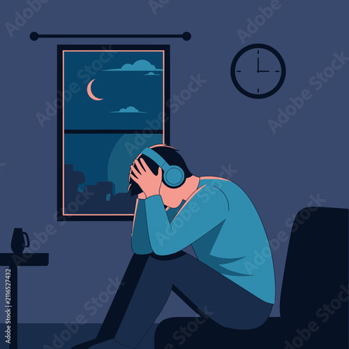 Depressed Man Listening To Music At Night Feeling Alone