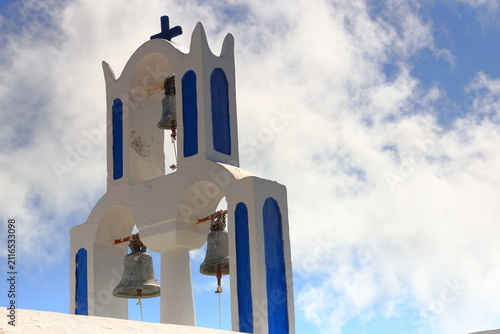 Orthodox Church with its multitiered bell tower facade in Santorini, Greece.