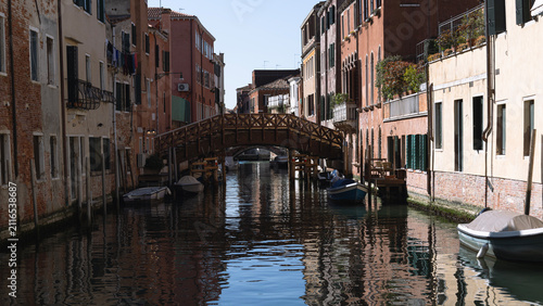 Принти на полотні Narrow canal of Venice, gondolas on the water, architecture of buildings