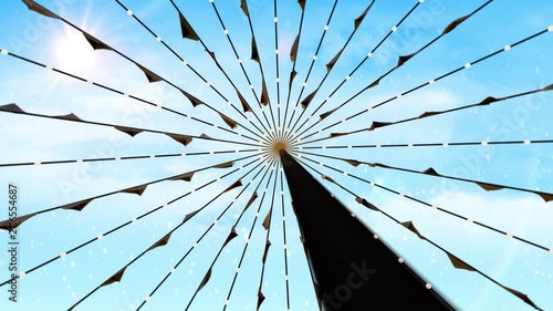 Hub and spokes centered while dark occluder sweeping creating brief blackout, then revealing canopy