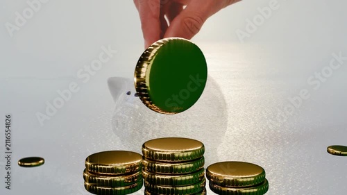 Hand entering holding coin, stacking coins, turning giant coin, dropping into piggy showing saving