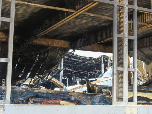 The aftermath of a devastating fire leaves a building in ruins,