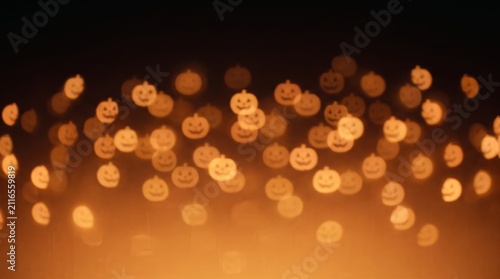 A soft bokeh background features numerous glowing orange pumpkin-shaped lights floating across a dark, warm-toned horizontal gradient canvas.