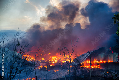 Fotografie Large Industrial Structure Burning During the Oraiokastro Wildfire Crisis