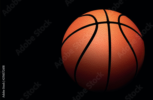 Orange basketball against a wooden background