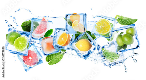 Canvas Print Citrus fruits in ice cubes and water splash in air on white background