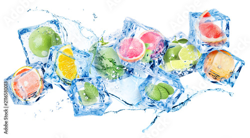 Photography Citrus fruits in ice cubes and water splash in air on white background