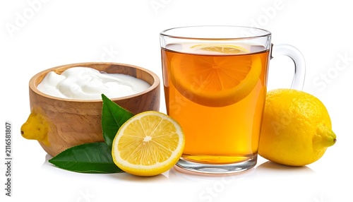 Hot tea with lemon and bowl of cream or yogurt, fresh lemons and green leaves, refreshing beverage and healthy snack