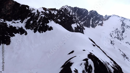 Drone Aerial View of Roopkund Glacial Lake with Snow-Covered Himalayas, Uttarakhand, India
