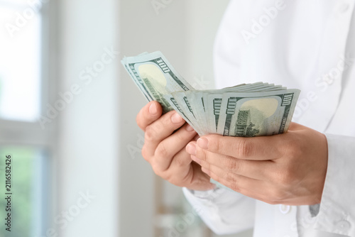 Person counting a stack of ...