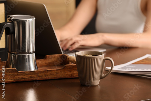 Woman working on laptop wit...