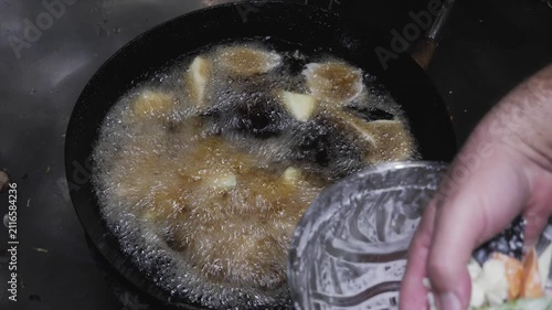 Deep Frying Battered Vegetables in Hot Wok Oil.