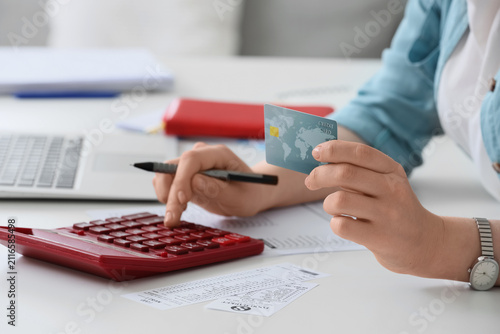 Person calculating expenses...