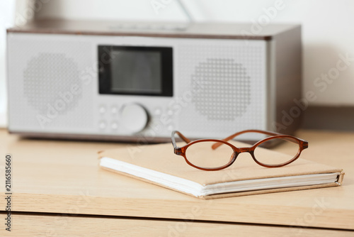 Brown reading glasses on a ...