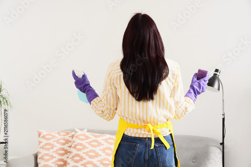 Woman in purple gloves and ...