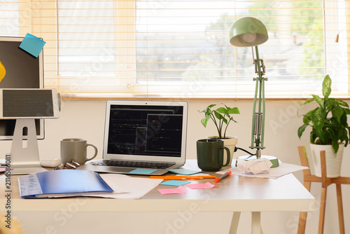 Home office desk with lapto...