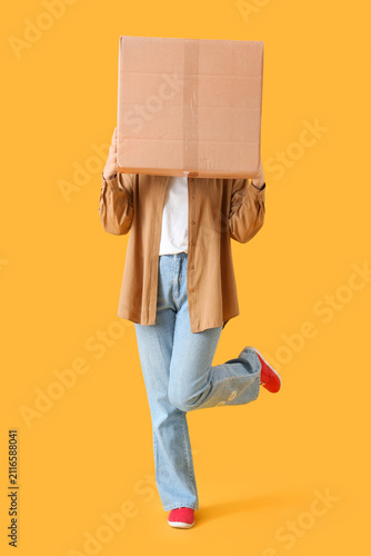 Young woman with parcel box...