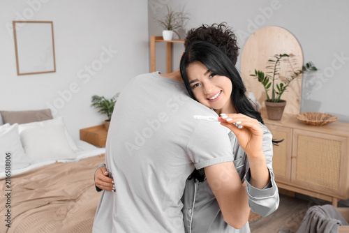 Happy young woman with preg...