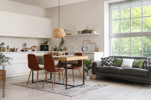 Table with chairs and sofa ...
