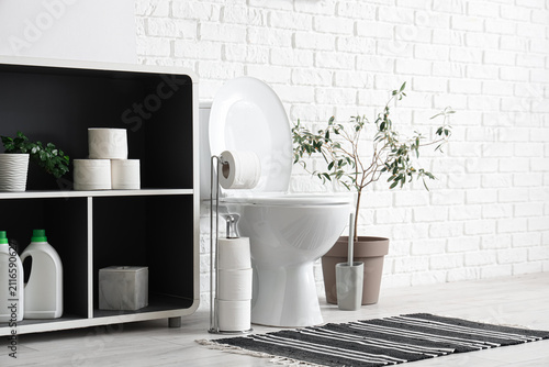 Toilet bowl, shelving unit ...