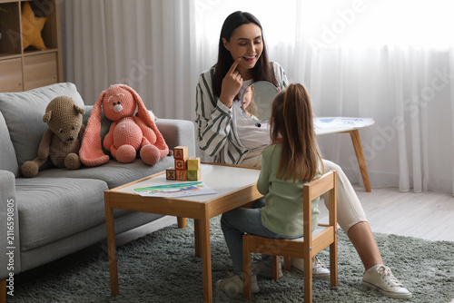 Female speech therapist wit...