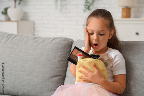 Shocked little girl with co...