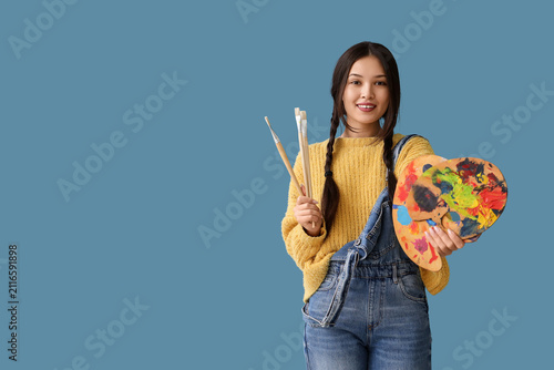 Female Asian artist with pa...