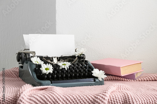 Vintage typewriter with pap...