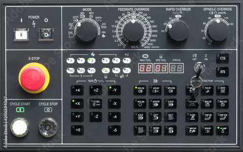 Control panel of modern metalworking machine tool equipped with buttons designed in style of keyboard, with labeled keys. tech industrial technology background