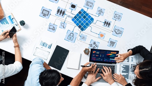 Cuadro en lienzo Collaborative Business Meeting with Data Analysis and Digital Networking Concepts in Modern Office Setting
