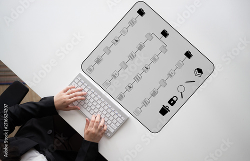 фотографія Creative Workflow Planning Concept with Keyboard, Icons, and Working Individual Over a Minimalistic Desk Environment