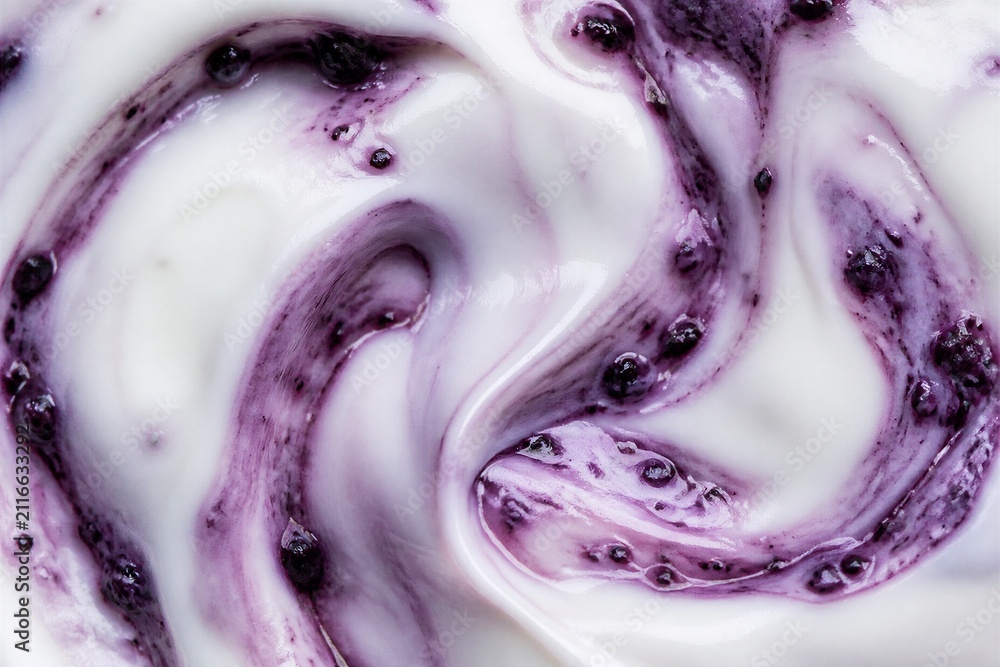 Obraz premium Blueberry yogurt swirl creating marbled texture closeup