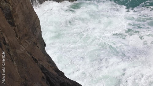 Waves crashing on the rocks of the Irish coastline at Mizen Head, County Cork, Ireland