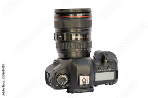 Obraz na plátne Professional DSLR camera with zoom lens on white background