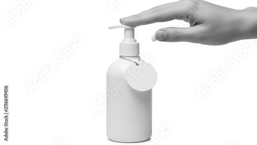 Hand pumping liquid soap from dispenser