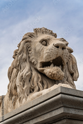 Konstfotografi Close-up of a carved stone lion with an open mouth guarding the entrance ramp of