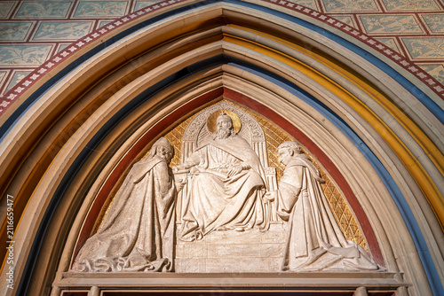 Photography Carved stone tympanum above the Saint Stephen Chapel entrance depicting an enthr
