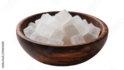 Fotografie Isolated pure white rock candy sugar crystals in a rustic wooden bowl for sweete