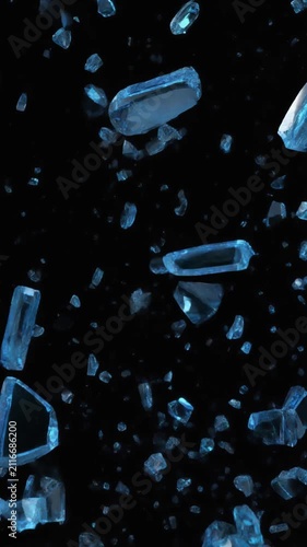 Blue glass shards shattering in slow motion on black background