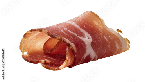 Isolated rolled slice of delicious cured ham or prosciutto with streaks of fat for food design