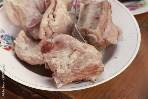 Pork pieces simmering before traditional Peruvian chicharrón preparation