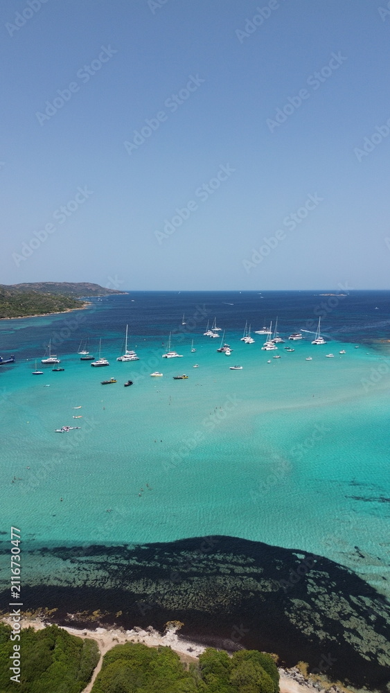 Obraz premium Drone View of Bright Turquoise Mediterranean Sea in Corsica, France