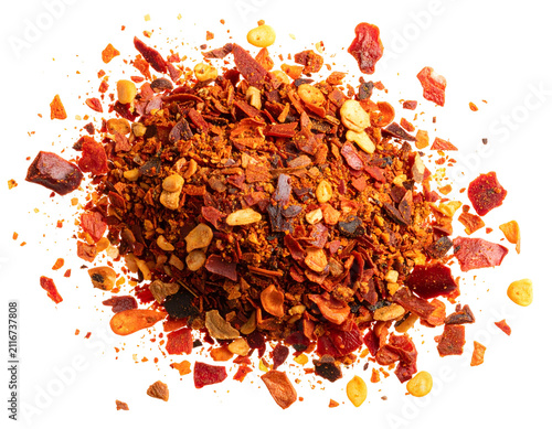 Dried Red Chili Pepper Flakes and Seeds Macro Shot Isolated on Black Background